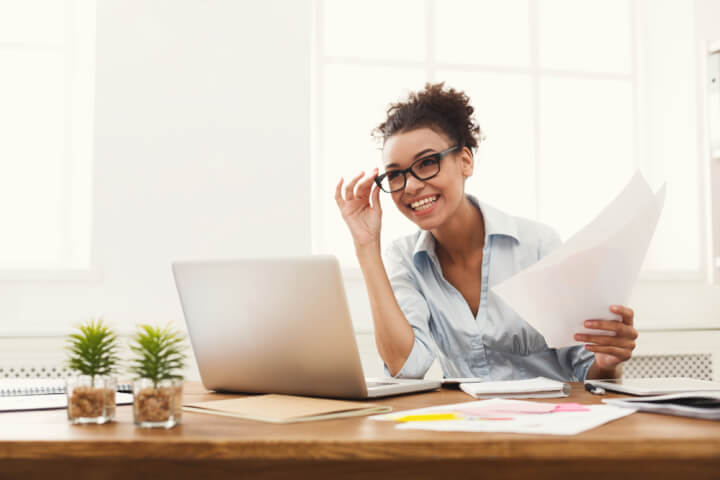 smiling woman with cover letter